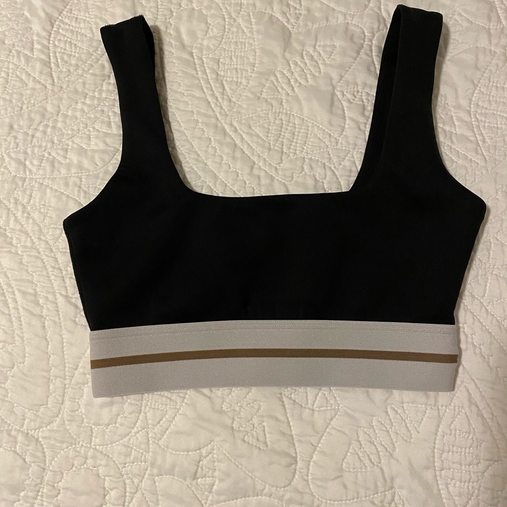 Shop TAN + LINES sports bra by Sivan
